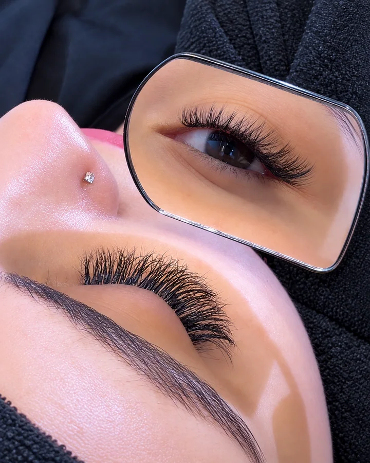 Lash extensions and mirror reflection at Dina Beauty Center